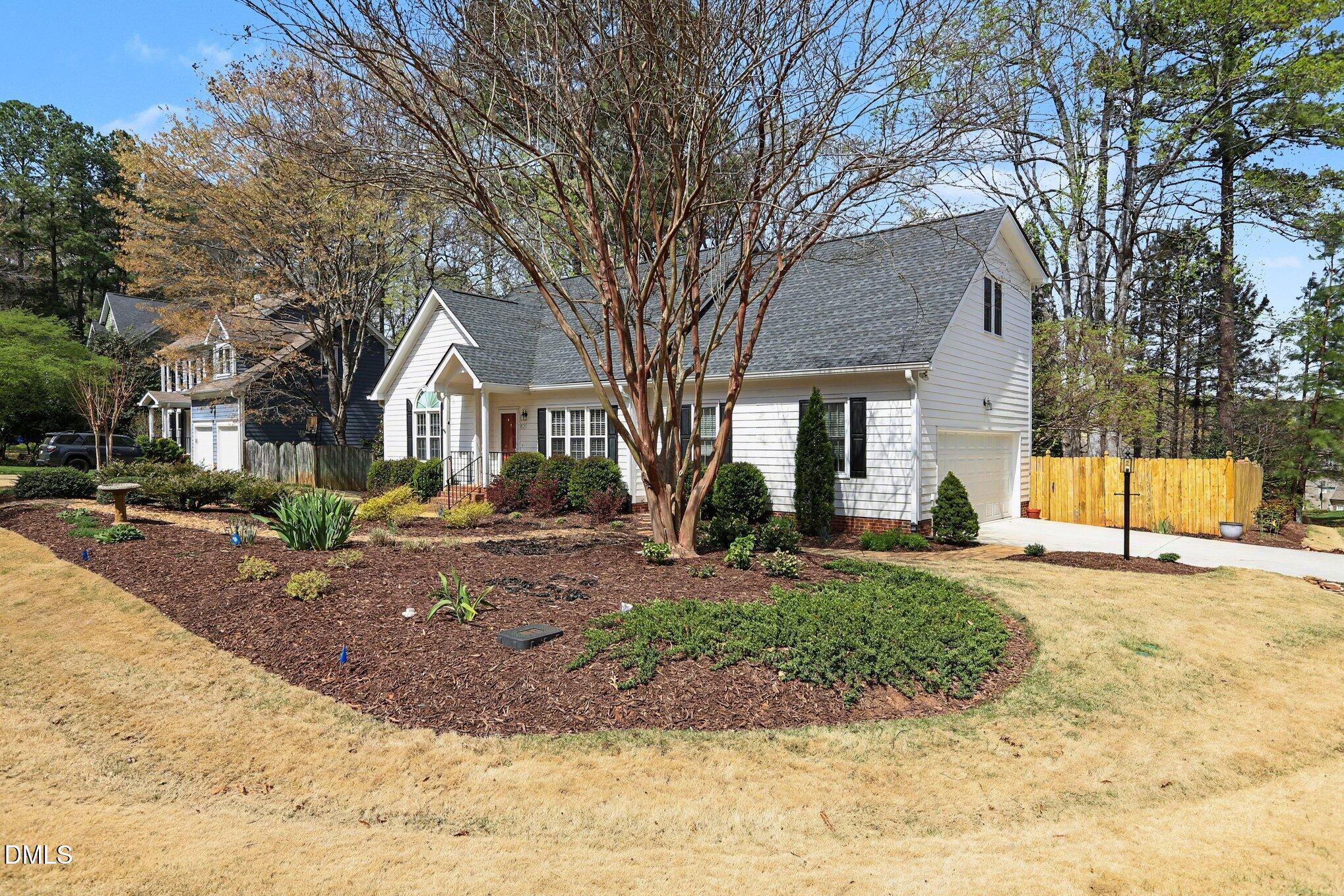 2616 Jasper Lane Raleigh, NC 27613 - Photo 2 of 44 a view of a yard in front of a house with large tree