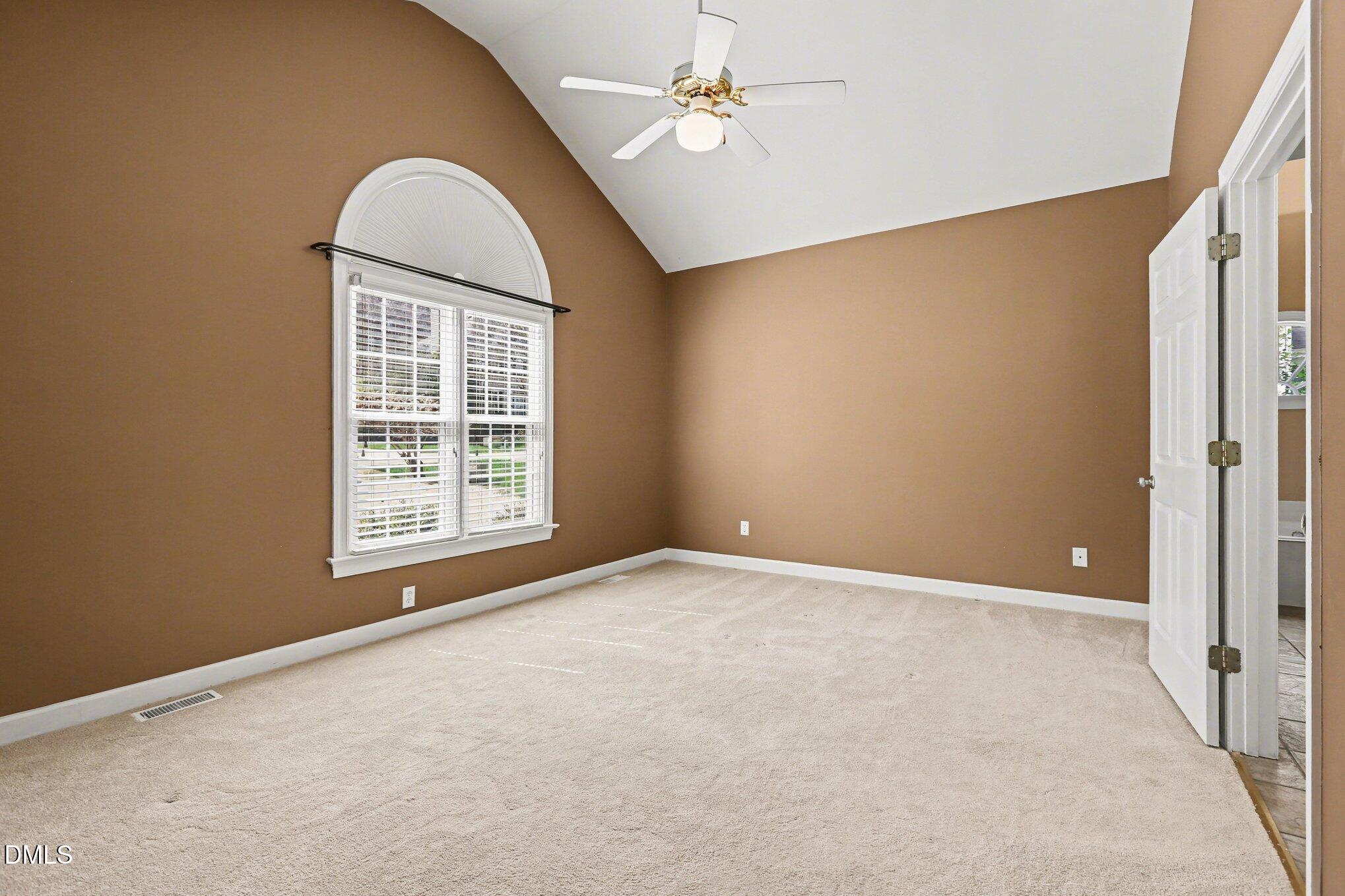 2616 Jasper Lane Raleigh, NC 27613 - Photo 32 of 44 an empty room with windows and fan