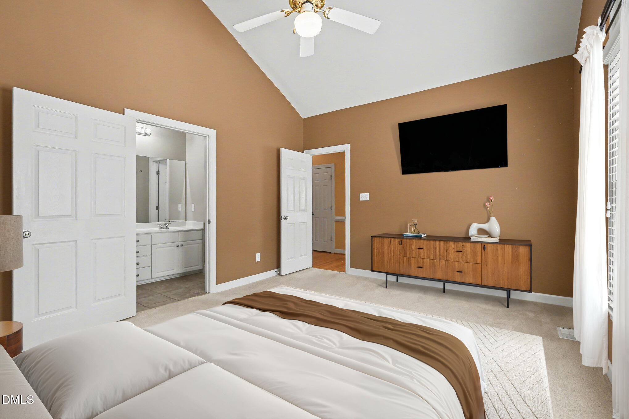 2616 Jasper Lane Raleigh, NC 27613 - Photo 33 of 44 a bedroom with a bed and a flat screen tv