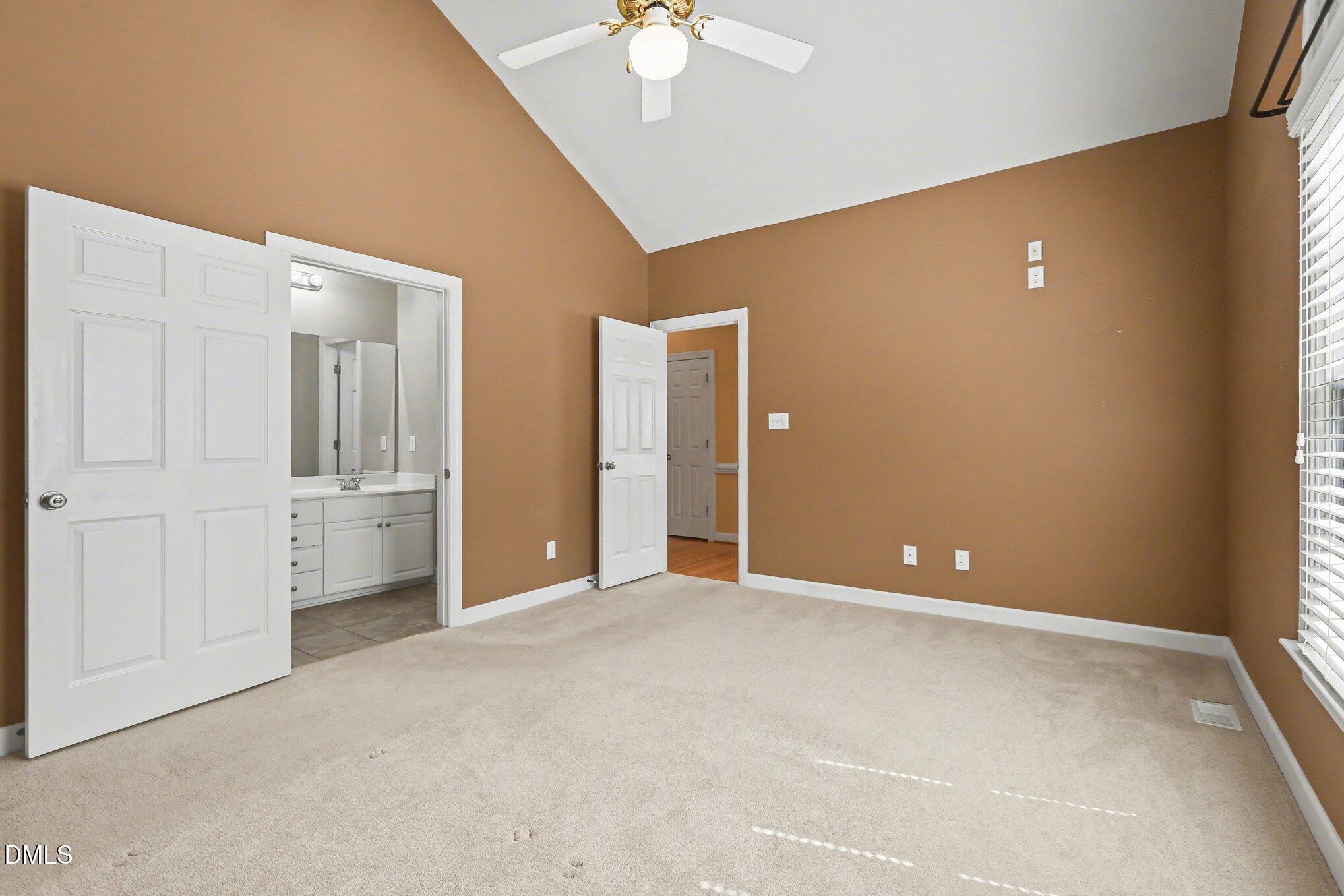 2616 Jasper Lane Raleigh, NC 27613 - Photo 34 of 44 an empty room with closet and a chandelier fan