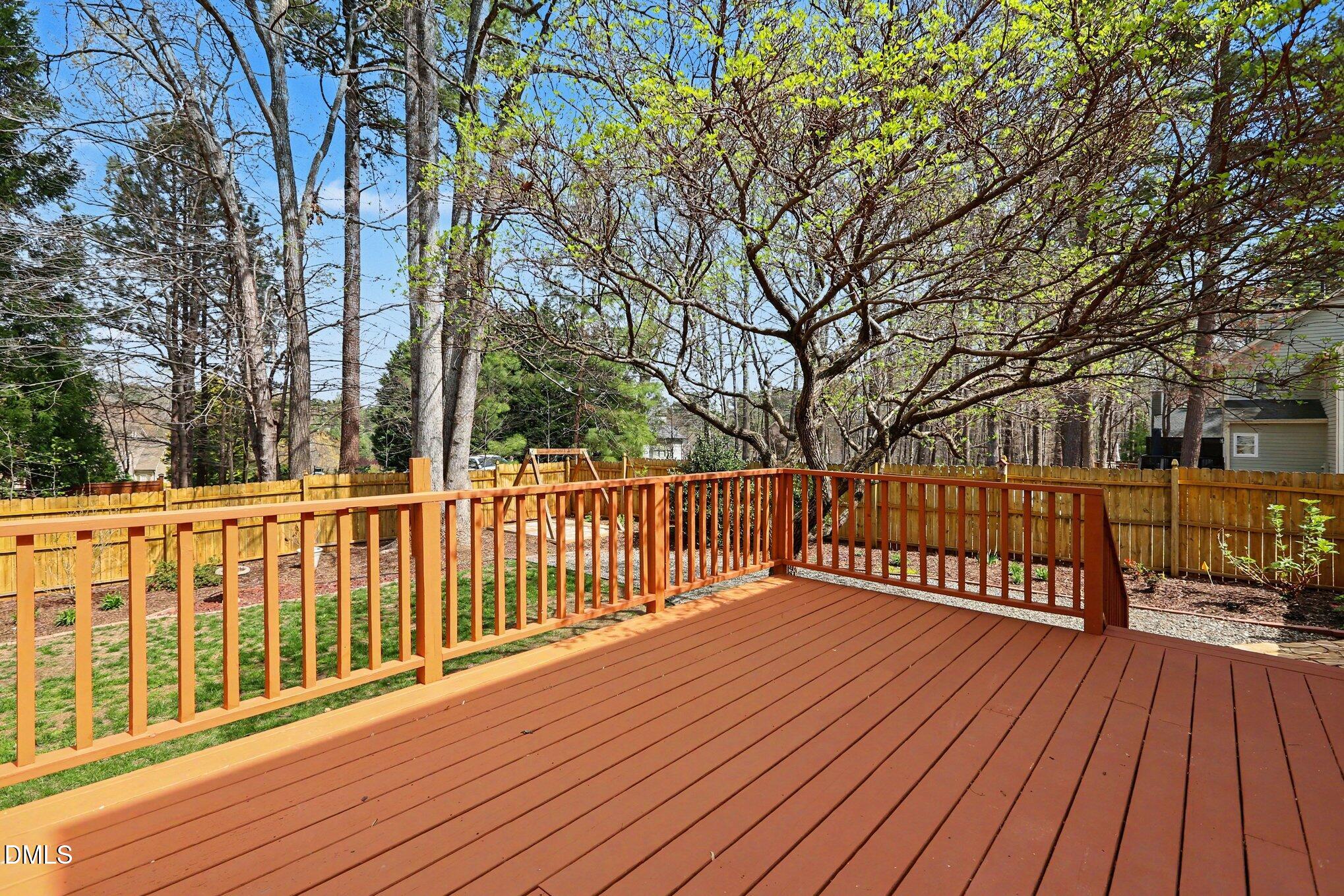 2616 Jasper Lane Raleigh, NC 27613 - Photo 38 of 44 a view of a wooden deck with trees
