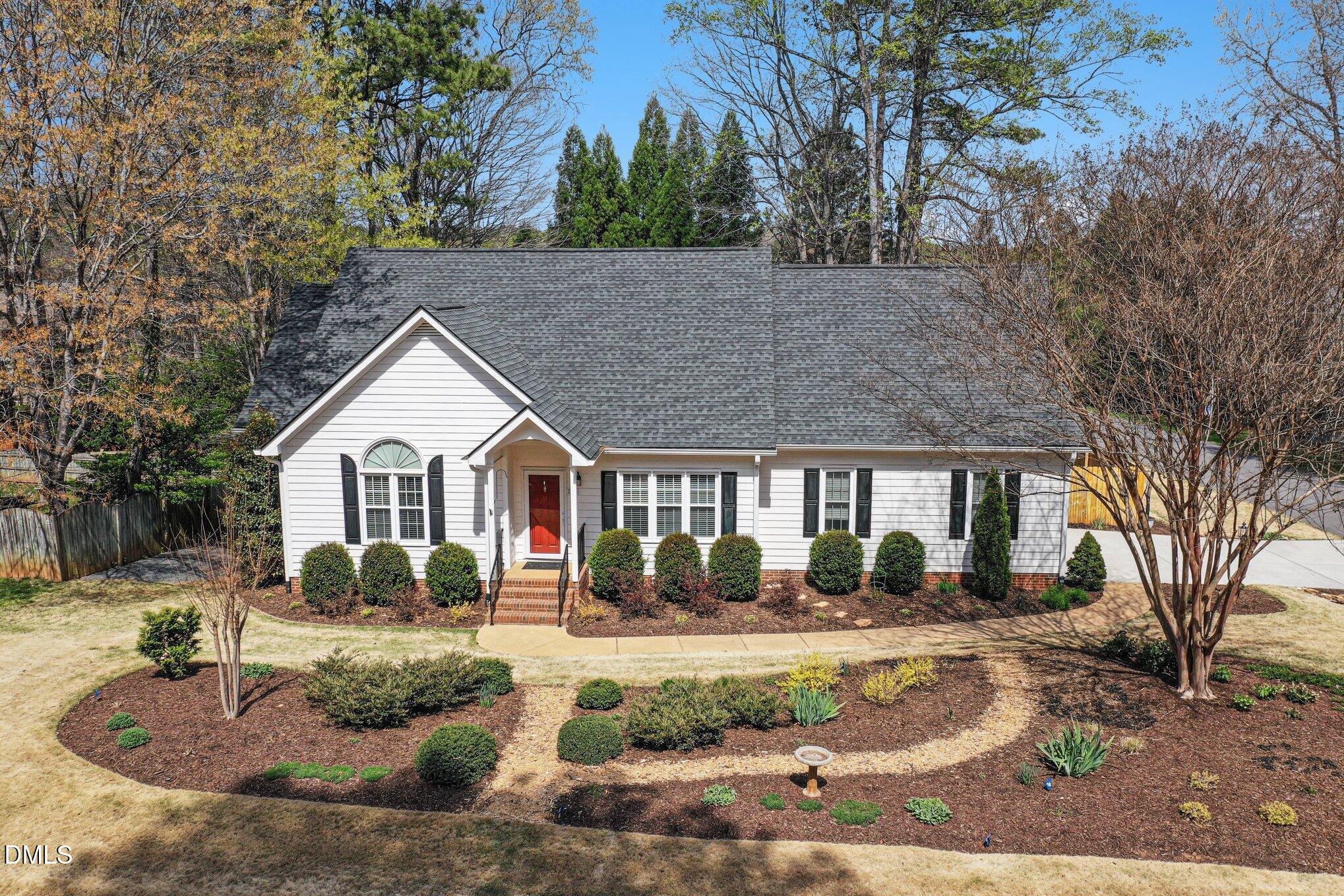 2616 Jasper Lane Raleigh, NC 27613 - Photo 3 of 44 a front view of a house with garden