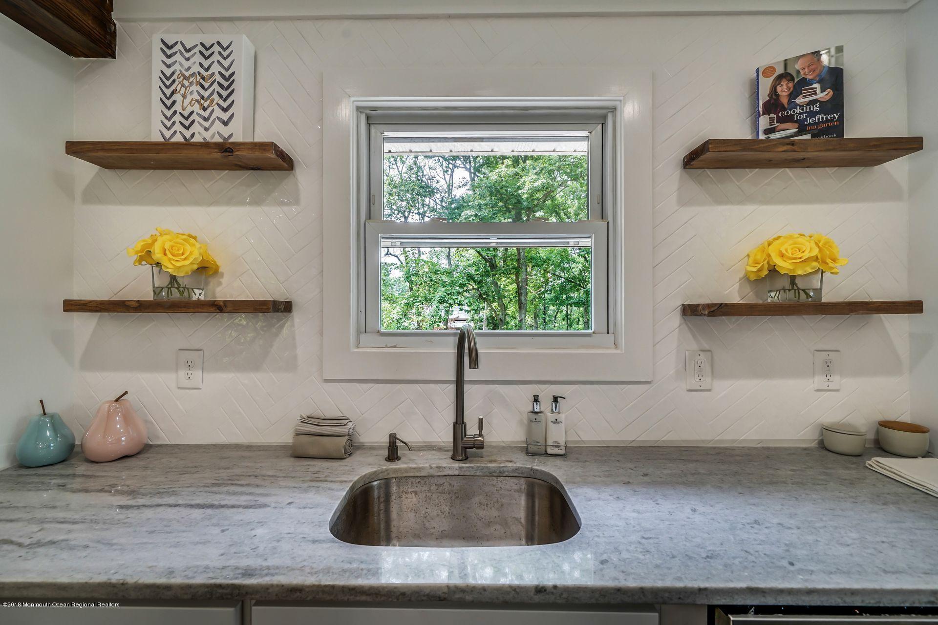 715 West Farms Road Howell, NJ 07731 - Photo 8 of 48 a kitchen with a sink and wooden floor