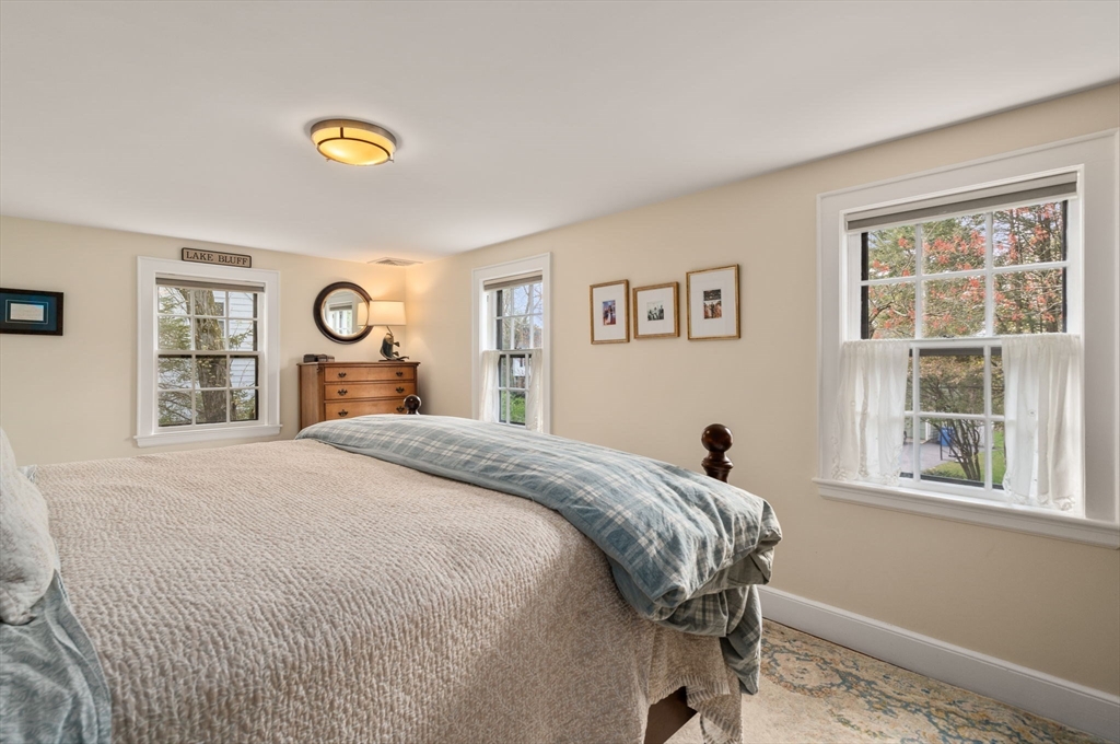 17 Roberts Road Wellesley, MA 02481 - Photo 17 of 34 a bedroom with a bed and window
