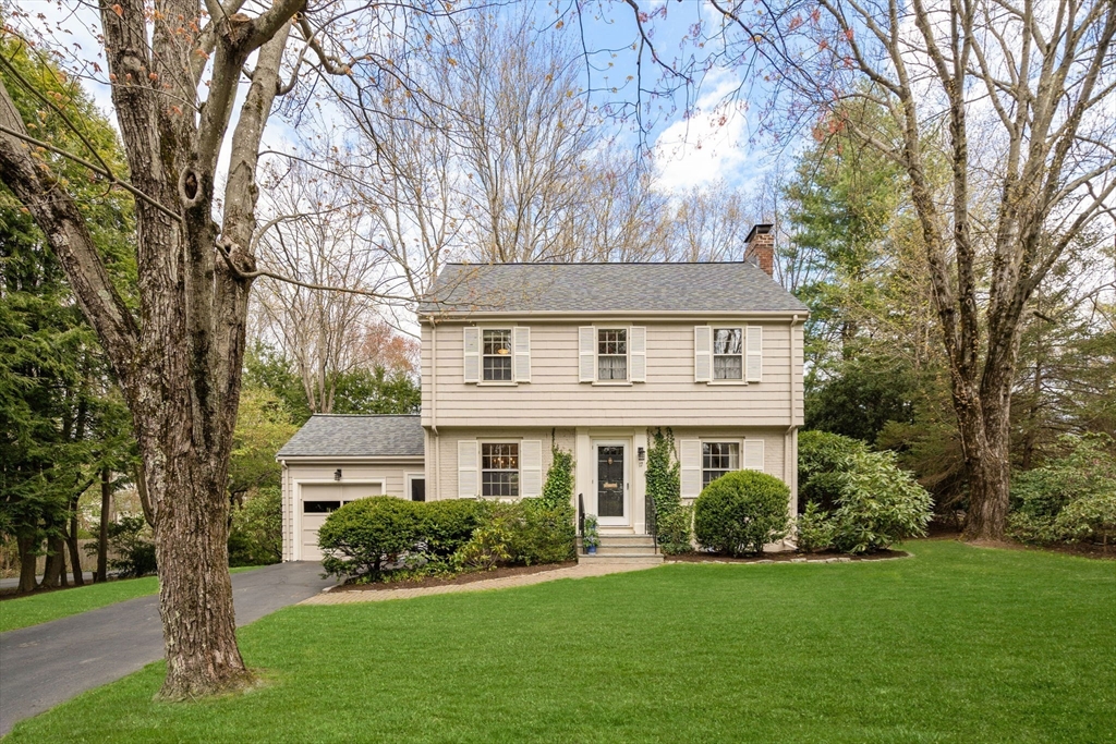 17 Roberts Road Wellesley, MA 02481 - Photo 2 of 34 a front view of a house with a garden