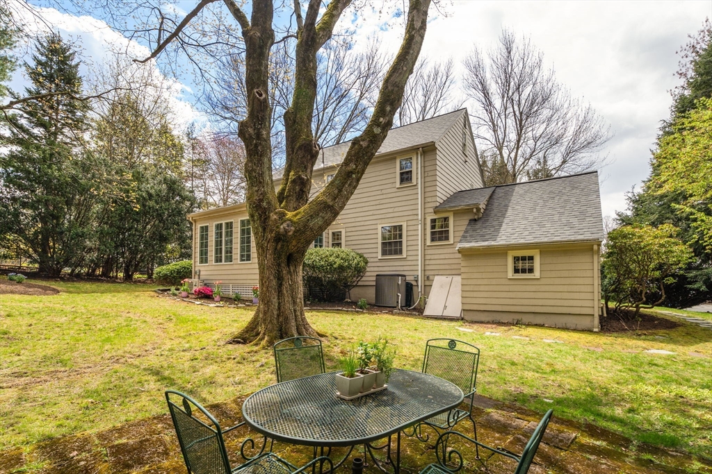 17 Roberts Road Wellesley, MA 02481 - Photo 27 of 34 a view of a house with a yard patio and fire pit