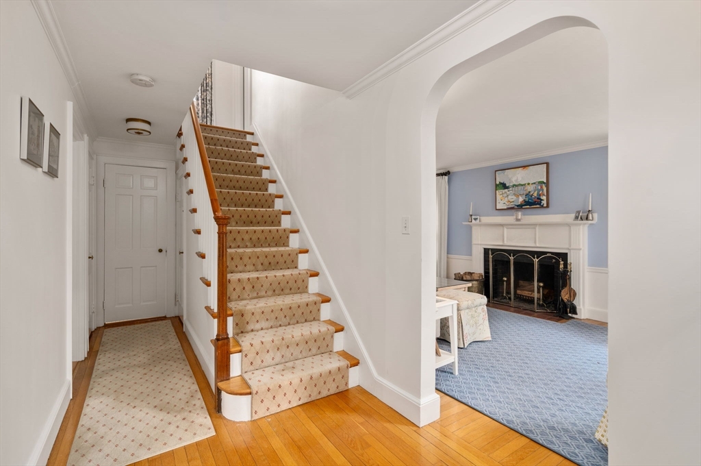 17 Roberts Road Wellesley, MA 02481 - Photo 6 of 34 a view of a livingroom with wooden floor and a fireplace