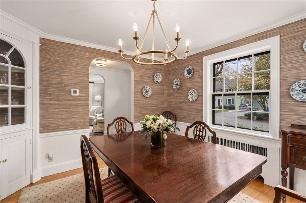 17 Roberts Road Wellesley, MA 02481 - Photo 10 of 34 a view of a dining room with furniture a chandelier and wooden floor