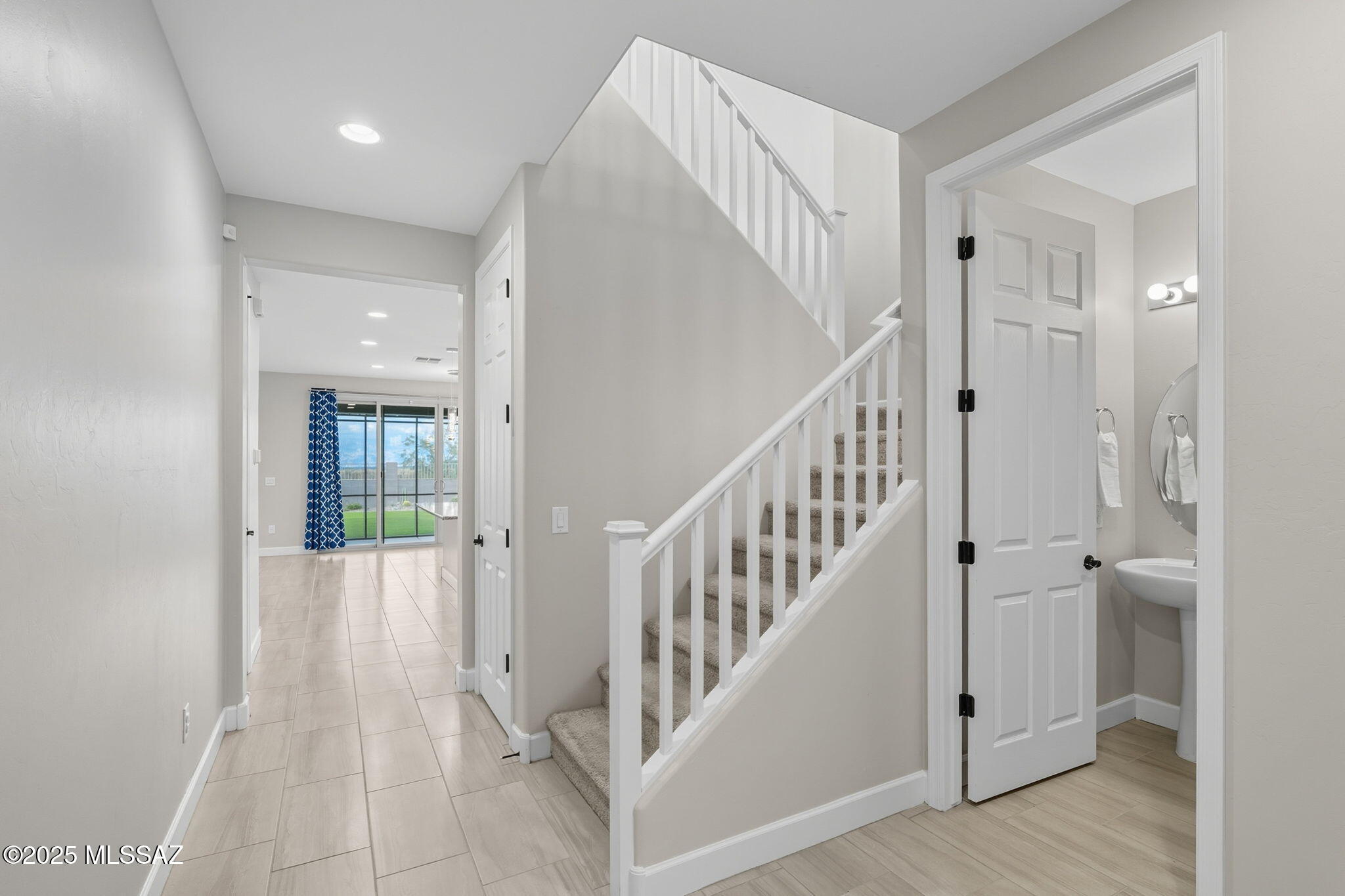 12100 East Ryscott Circle Vail, AZ 85641 - Photo 5 of 53 a view of an entryway with wooden floor and stairs
