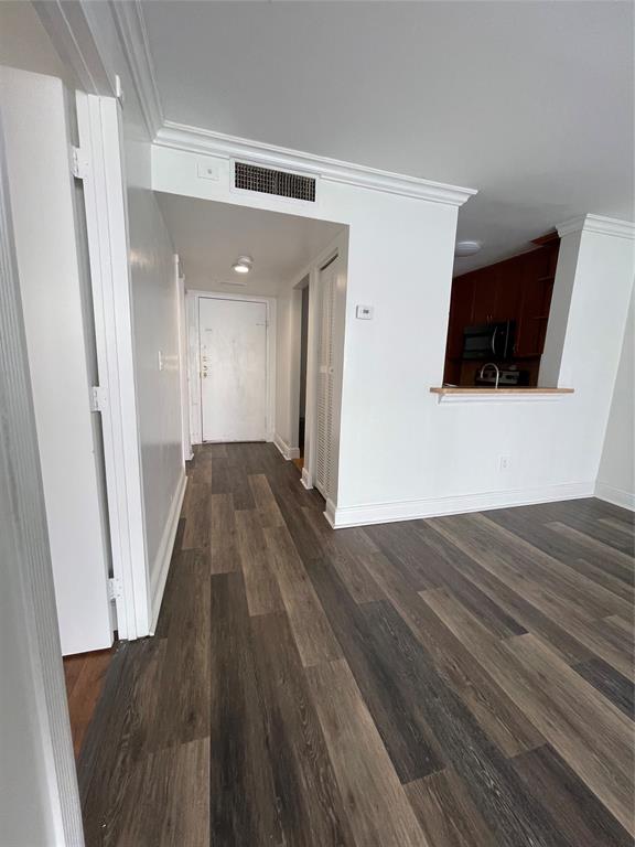 492 Northwest 165th Street Miami, FL 33169 - Photo 14 of 27 a view of a livingroom with wooden floor and a flat screen tv