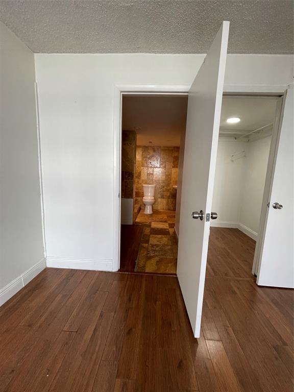 492 Northwest 165th Street Miami, FL 33169 - Photo 20 of 27 a view of a hallway with wooden floor and a living room