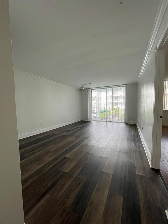492 Northwest 165th Street Miami, FL 33169 - Photo 7 of 27 wooden floor in an empty room with a window