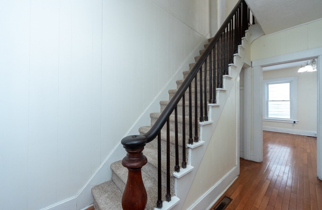 85 Beacon Street Clinton, MA 01510 - Photo 16 of 39 a view of entryway and gallery with wooden floor