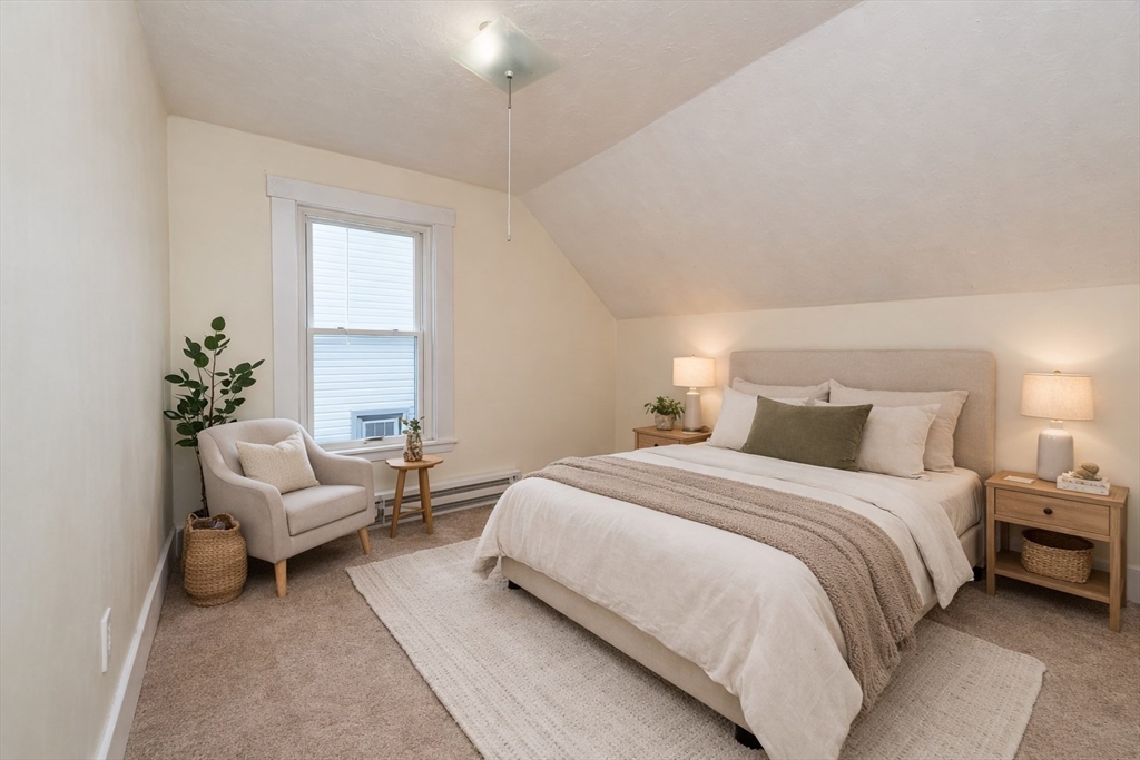 85 Beacon Street Clinton, MA 01510 - Photo 20 of 39 a bedroom with a bed and a couch