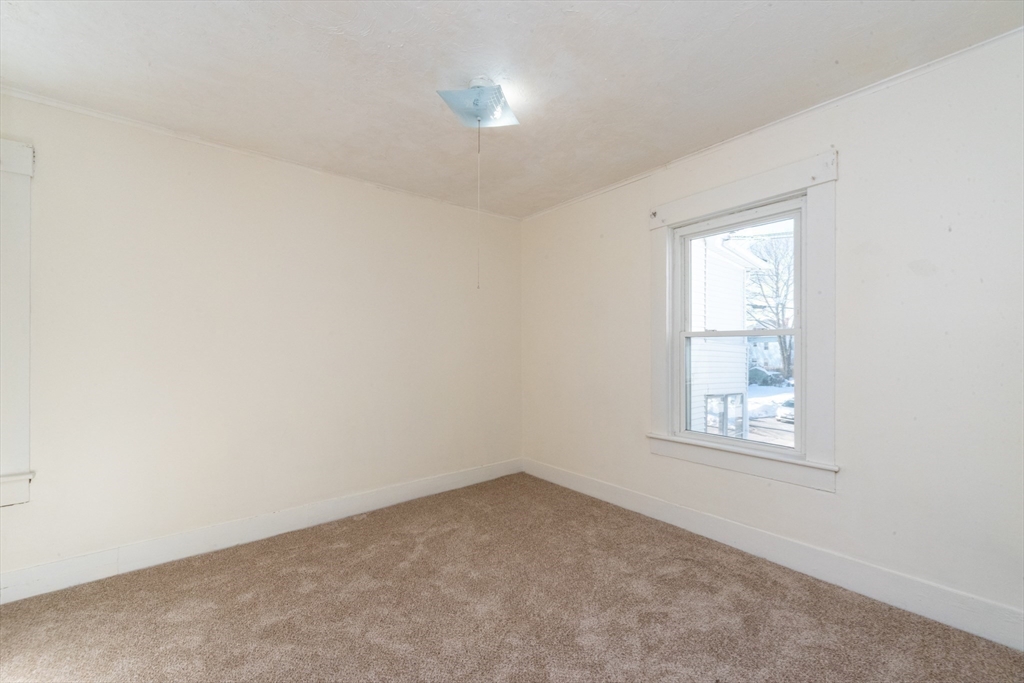 85 Beacon Street Clinton, MA 01510 - Photo 28 of 39 an empty room with windows