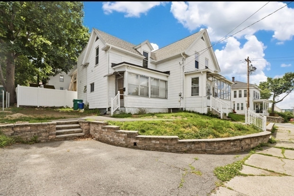 85 Beacon Street Clinton, MA 01510 - Photo 34 of 39 a front view of a house with a yard