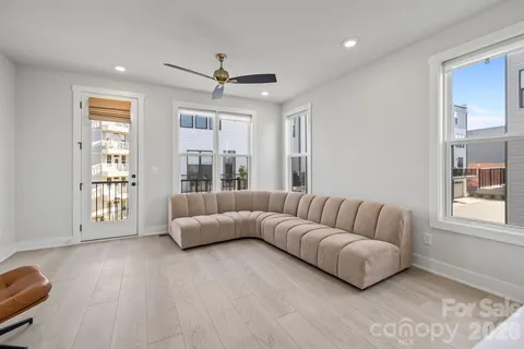 a living room with furniture and windows
