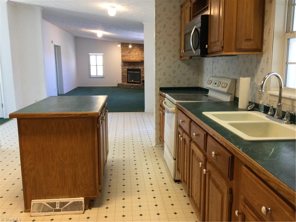1027 Old Wagon Road King, NC 27021 - Photo 11 of 35 kitchen island offers storage and electricty