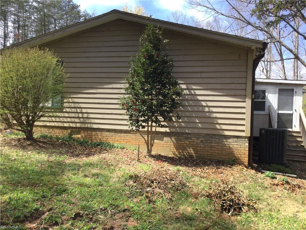 1027 Old Wagon Road King, NC 27021 - Photo 31 of 35 Sunroom has exit doors on both sides for convenient entry no matter which side you need