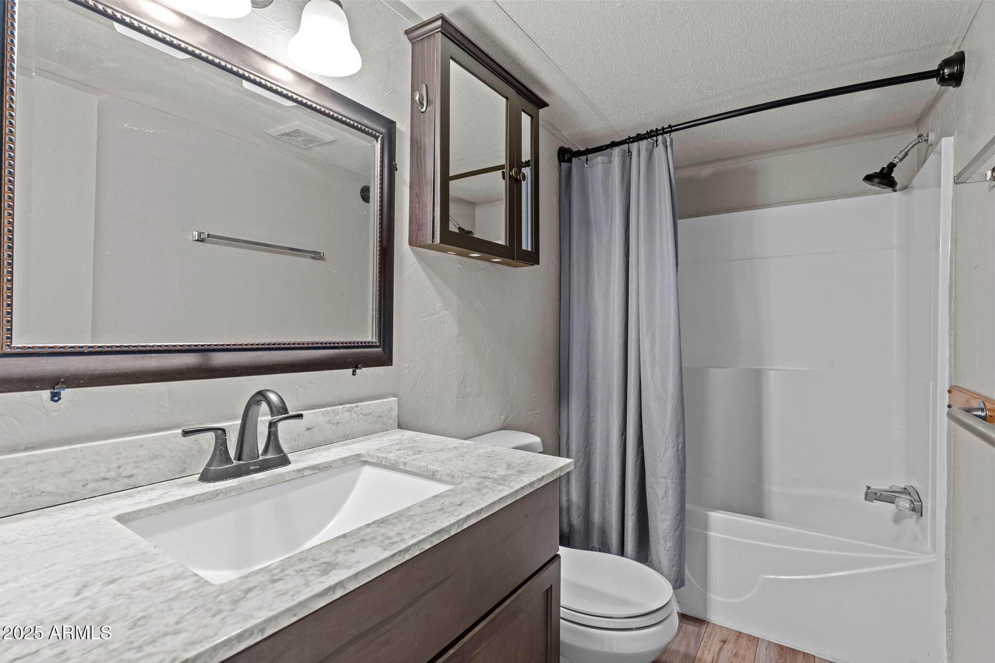 21199 West Escapee Way Congress, AZ 85332 - Photo 12 of 23 a bathroom with a granite countertop sink toilet and shower