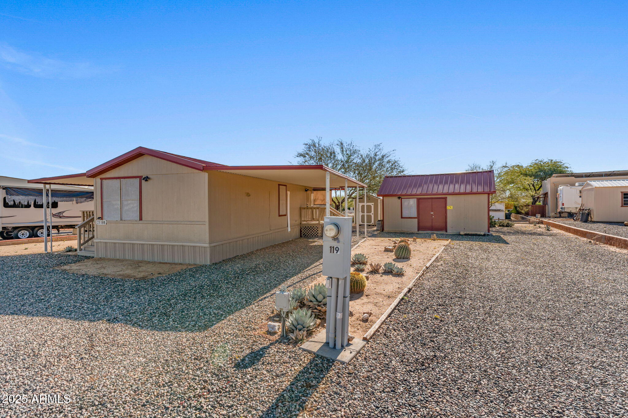 21199 West Escapee Way Congress, AZ 85332 - Photo 2 of 23 a front view of a house with garden