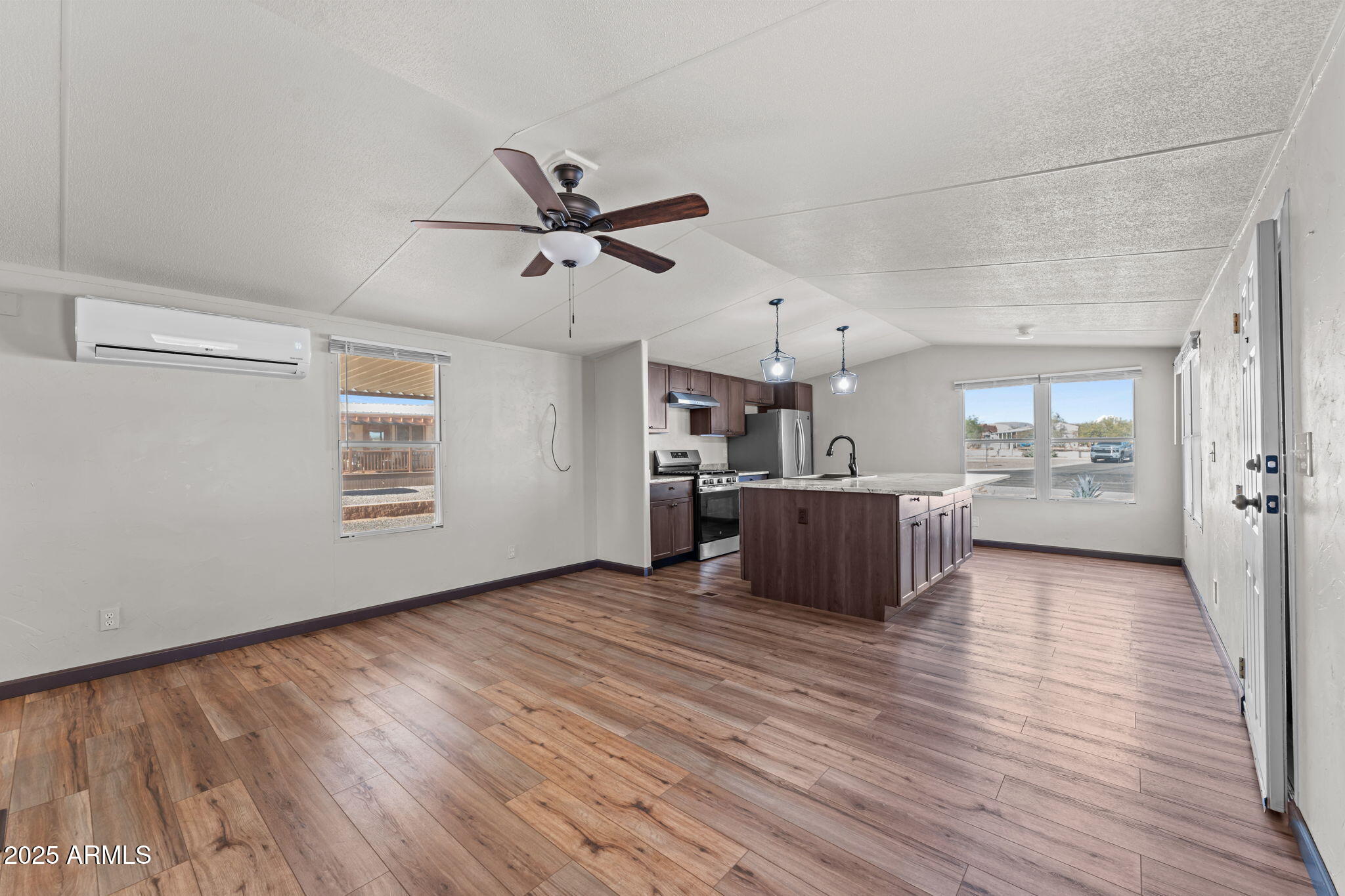 21199 West Escapee Way Congress, AZ 85332 - Photo 3 of 23 a view of a kitchen with a sink and a window