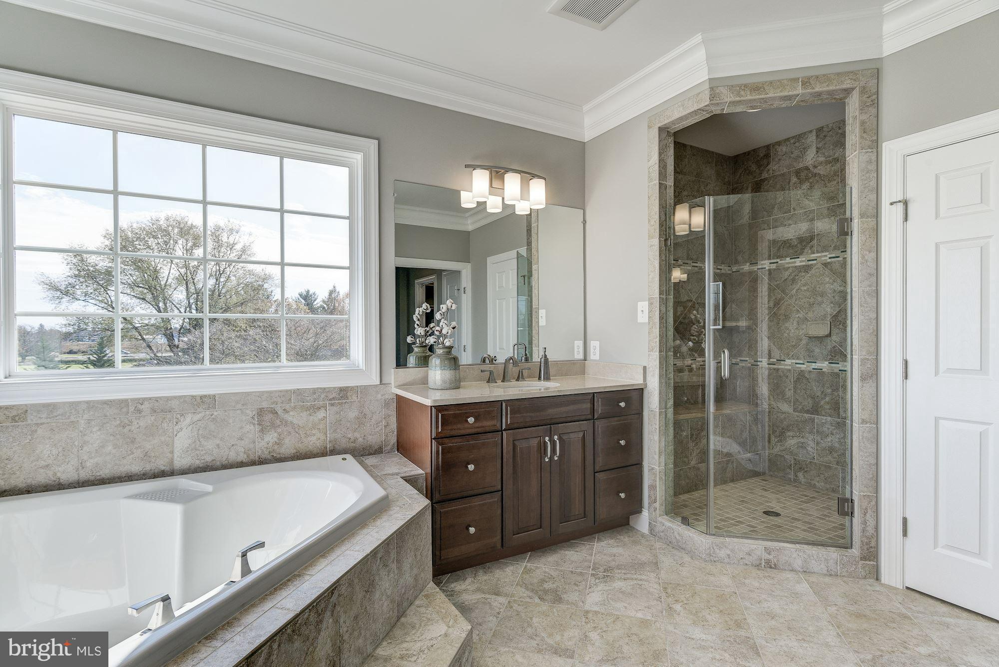 17919 Elgin Road Poolesville, MD 20837 - Photo 23 of 25 a bathroom with a bathtub and a sink