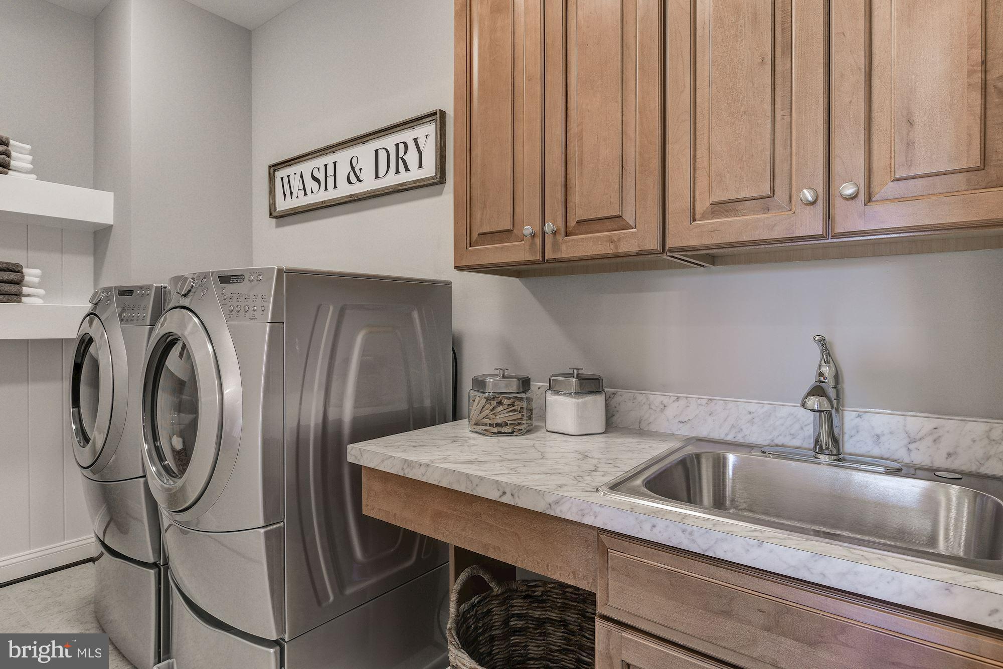 17919 Elgin Road Poolesville, MD 20837 - Photo 24 of 25 a kitchen with stainless steel appliances granite countertop a sink a refrigerator and cabinets