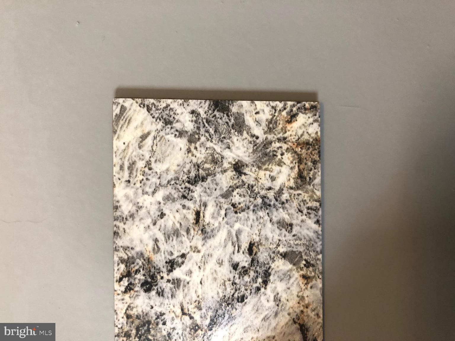 7902 Crows Nest Court, Unit 345 Laurel, MD 20707 - Photo 33 of 35 Counter top sample next to cabinet color