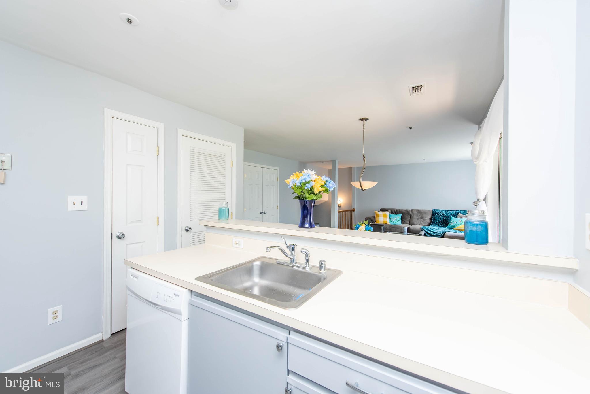 7902 Crows Nest Court, Unit 345 Laurel, MD 20707 - Photo 6 of 35 Kitchen w/new LVT flooring & fresh paint