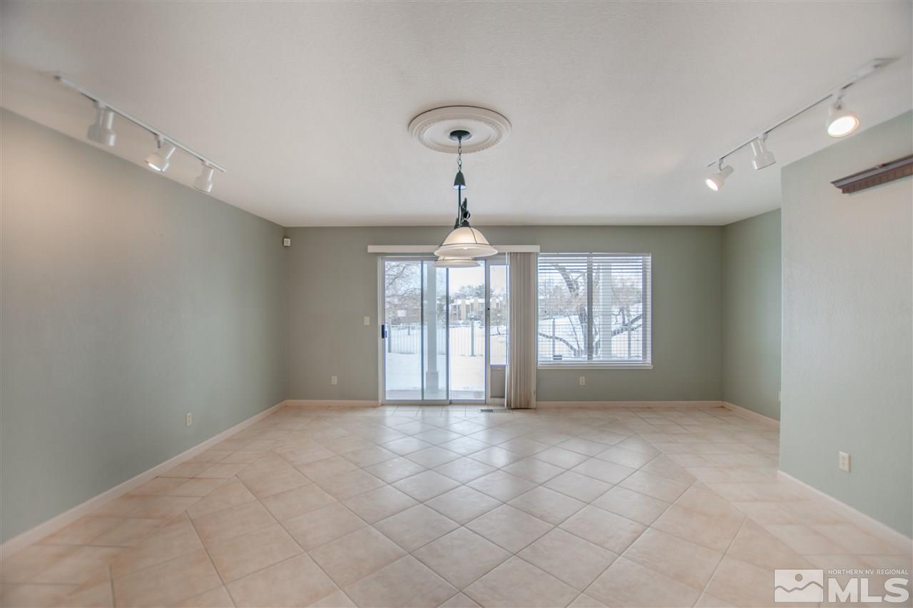 6174 Carriage House Way Reno, NV 89519 - Photo 15 of 22 a view of an empty room with a window