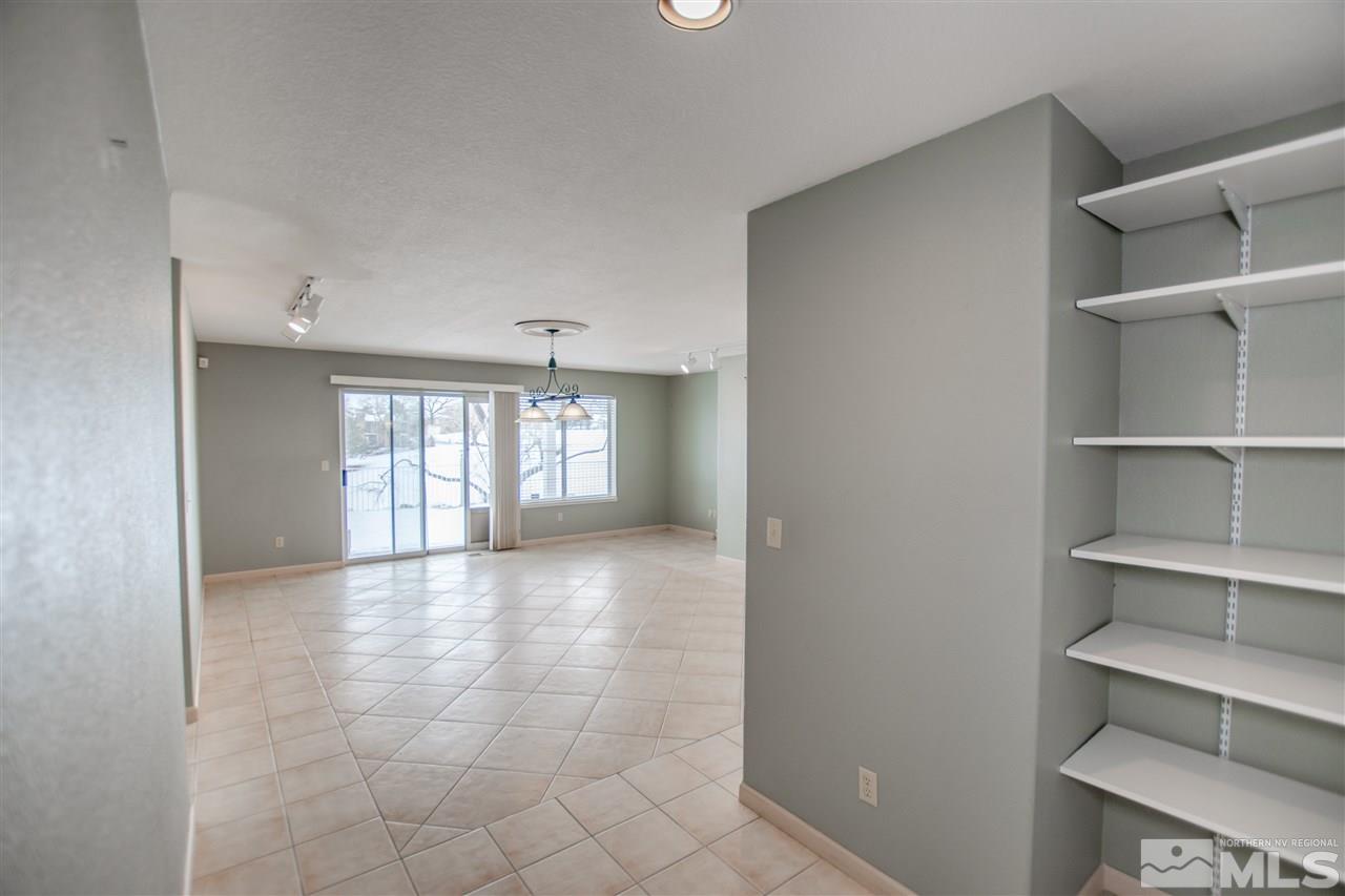 6174 Carriage House Way Reno, NV 89519 - Photo 16 of 22 a view of an empty room with a window