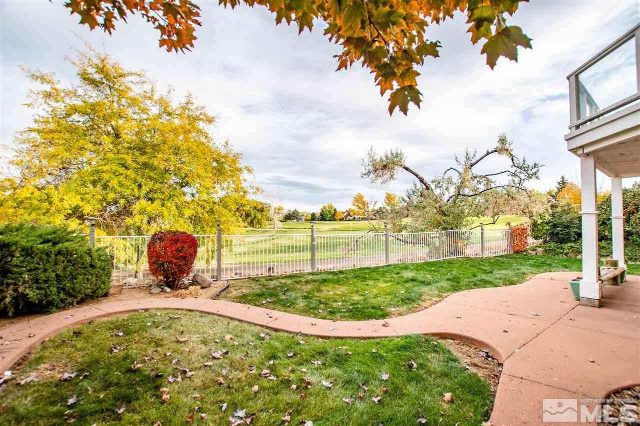 6174 Carriage House Way Reno, NV 89519 - Photo 6 of 22 a view of a garden with a fountain