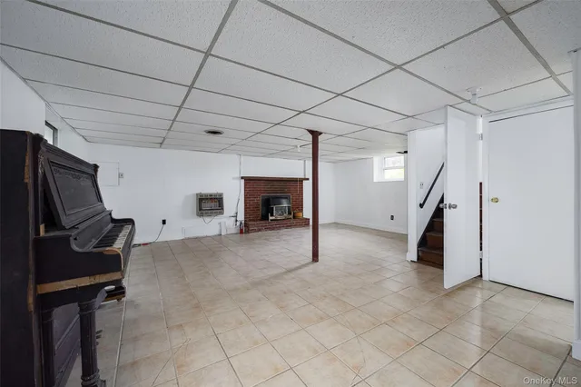 a view of a livingroom with furniture and staircase