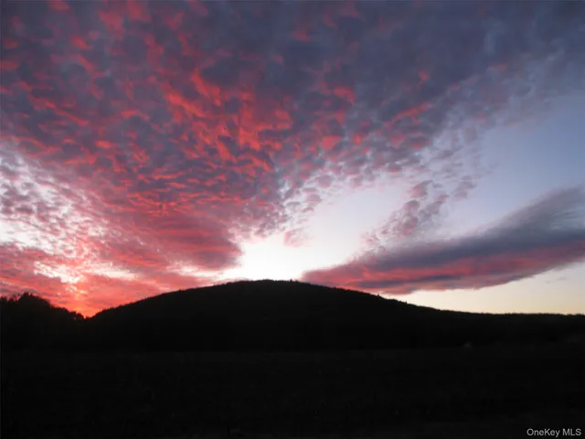 a view of mountain with lake view