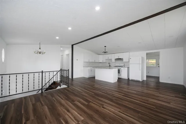 a view of kitchen with wooden floor
