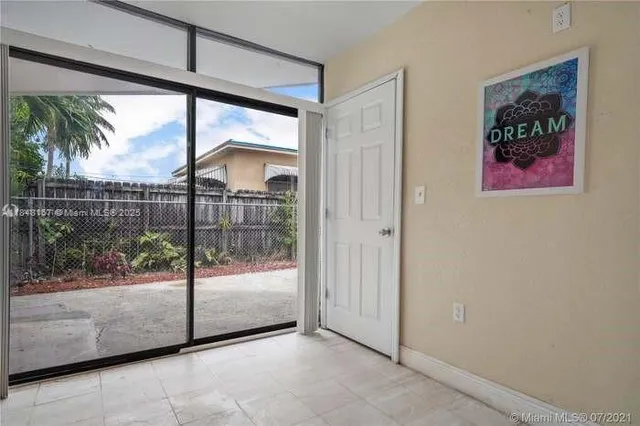 a backyard of a house with seating space