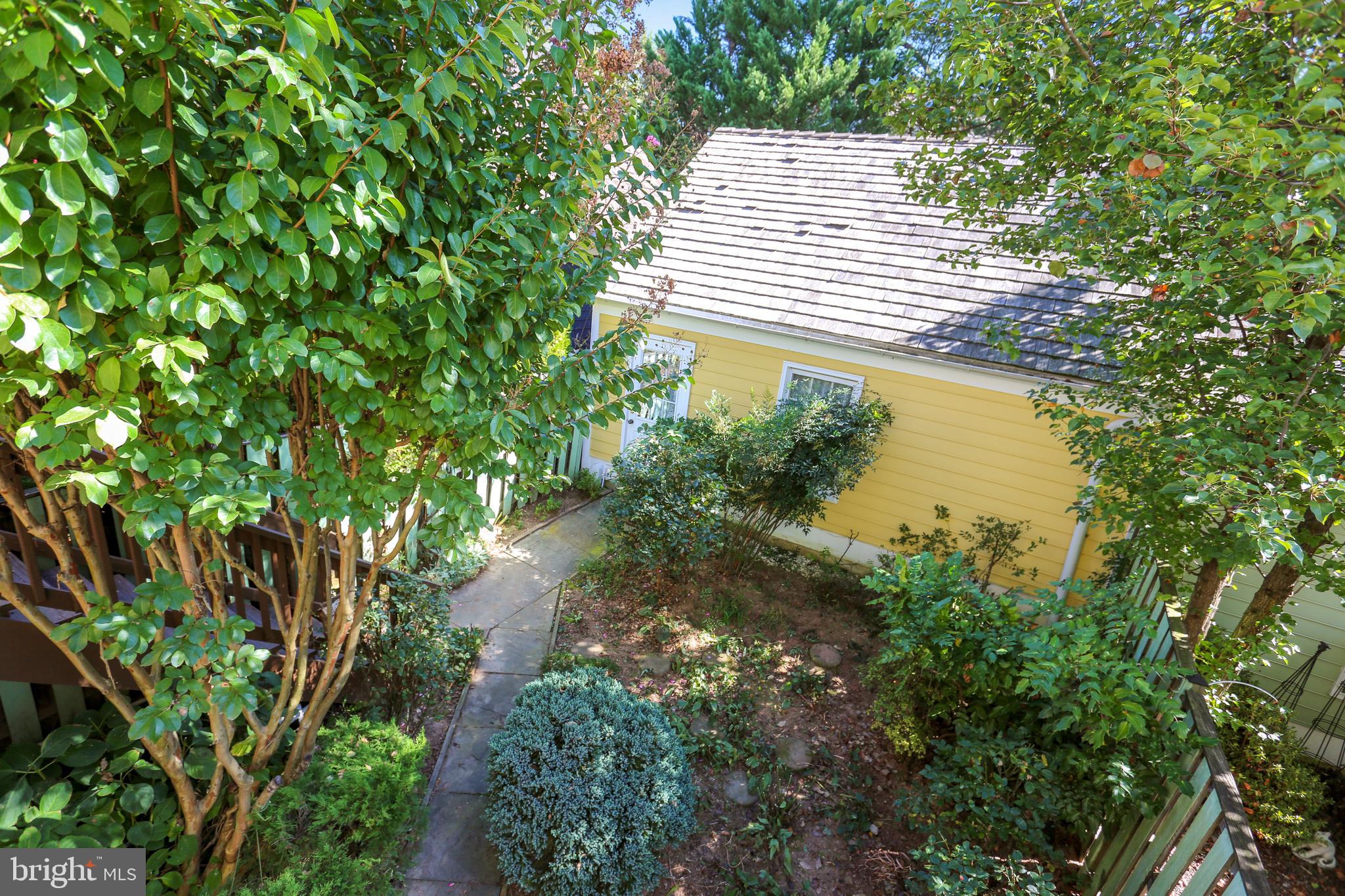 477 Tschiffely Square Road Gaithersburg, MD 20878 - Photo 34 of 40 View of gardens and garage
