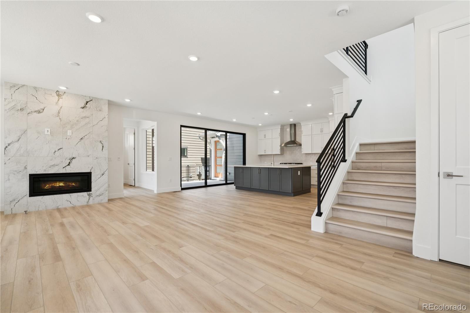 11196 Vibrato Lane Lone Tree, CO 80134 - Photo 16 of 45 a view of entryway and hall with wooden floor