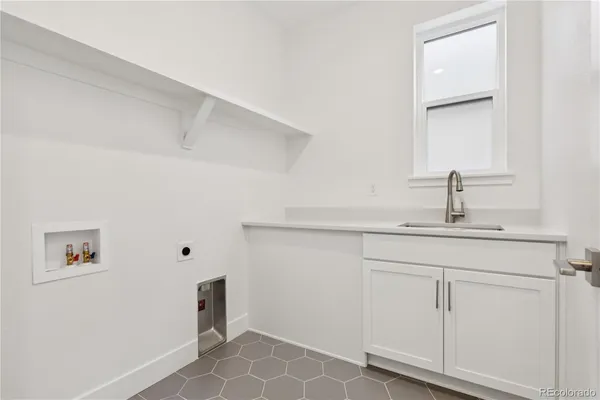 an empty room with windows and stairs