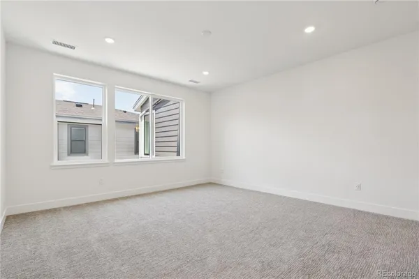 a view of backyard with large windows