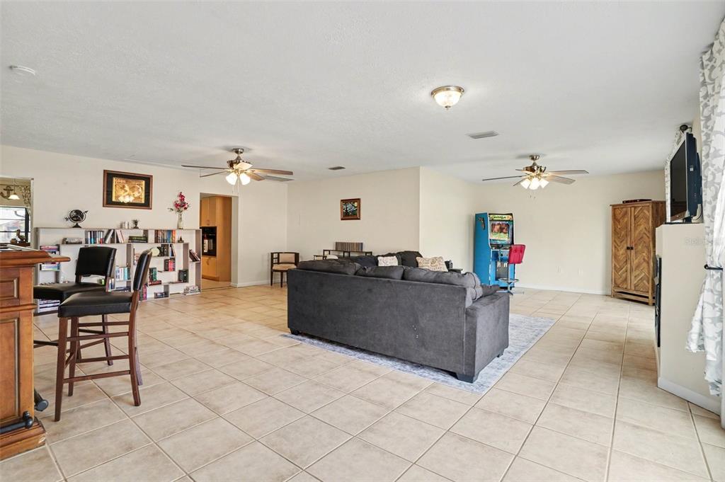 4105 Spring Way Circle Valrico, FL 33596 - Photo 19 of 34 a living room with furniture and a flat screen tv