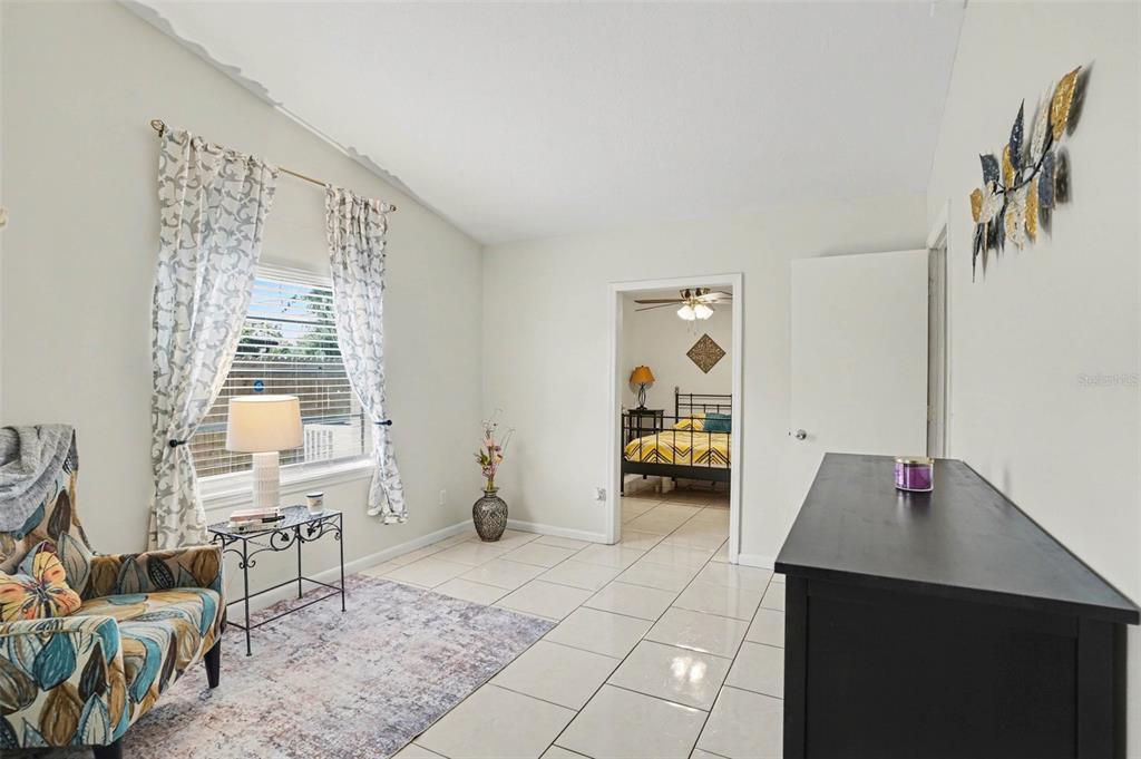 4105 Spring Way Circle Valrico, FL 33596 - Photo 22 of 34 a living room with furniture and a table
