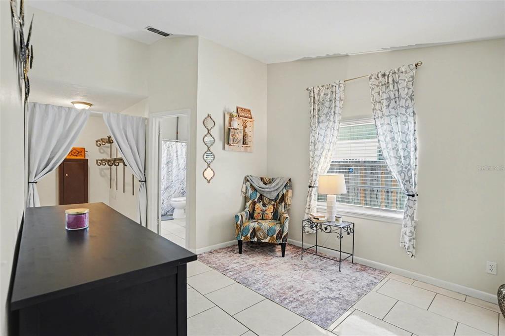 4105 Spring Way Circle Valrico, FL 33596 - Photo 23 of 34 a living room with furniture and a window