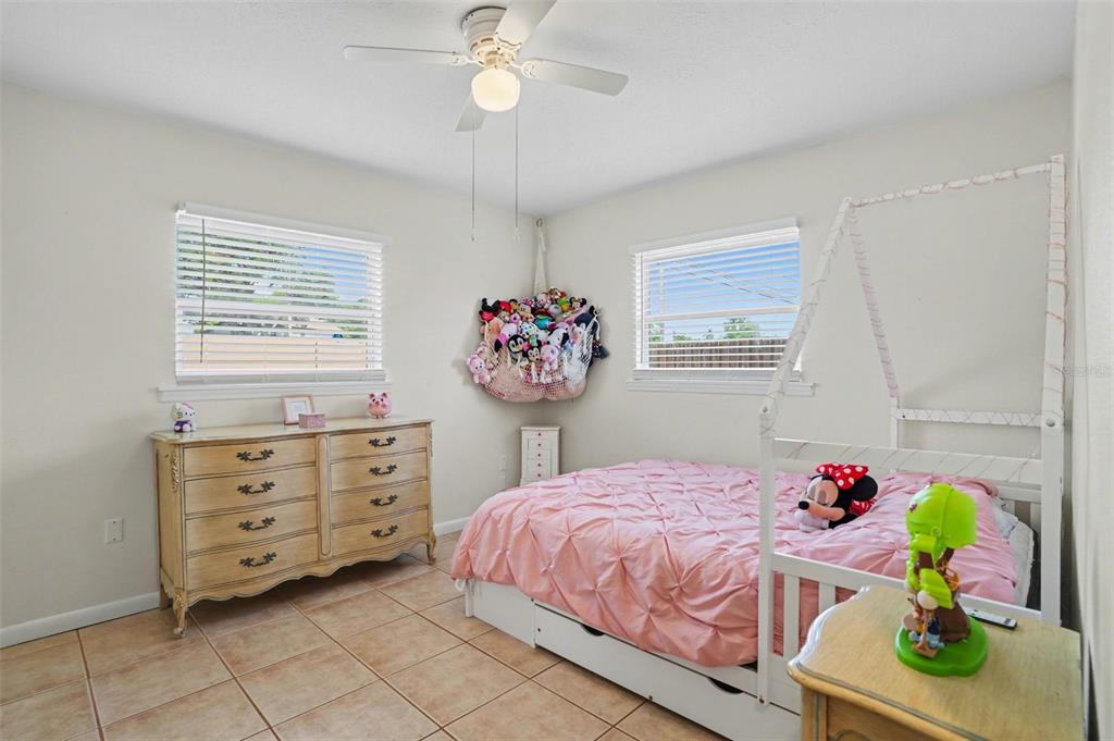 4105 Spring Way Circle Valrico, FL 33596 - Photo 26 of 34 a bedroom with a bed dresser and a window