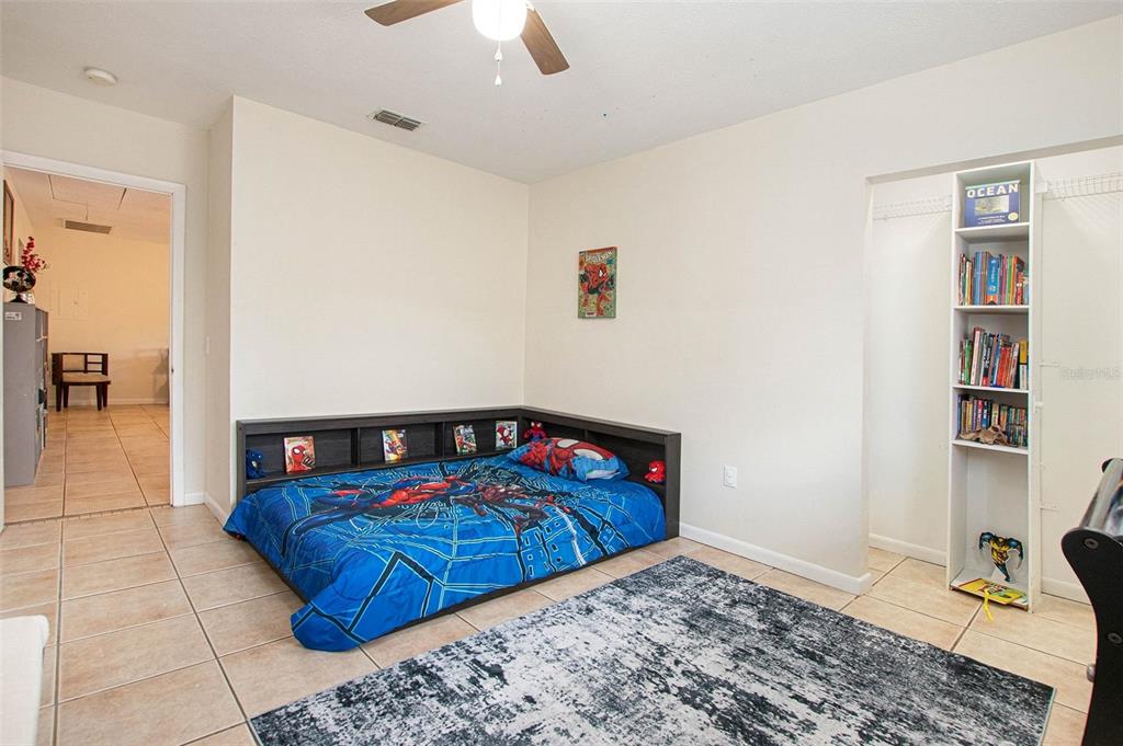 4105 Spring Way Circle Valrico, FL 33596 - Photo 28 of 34 a bedroom with a bed and dresser