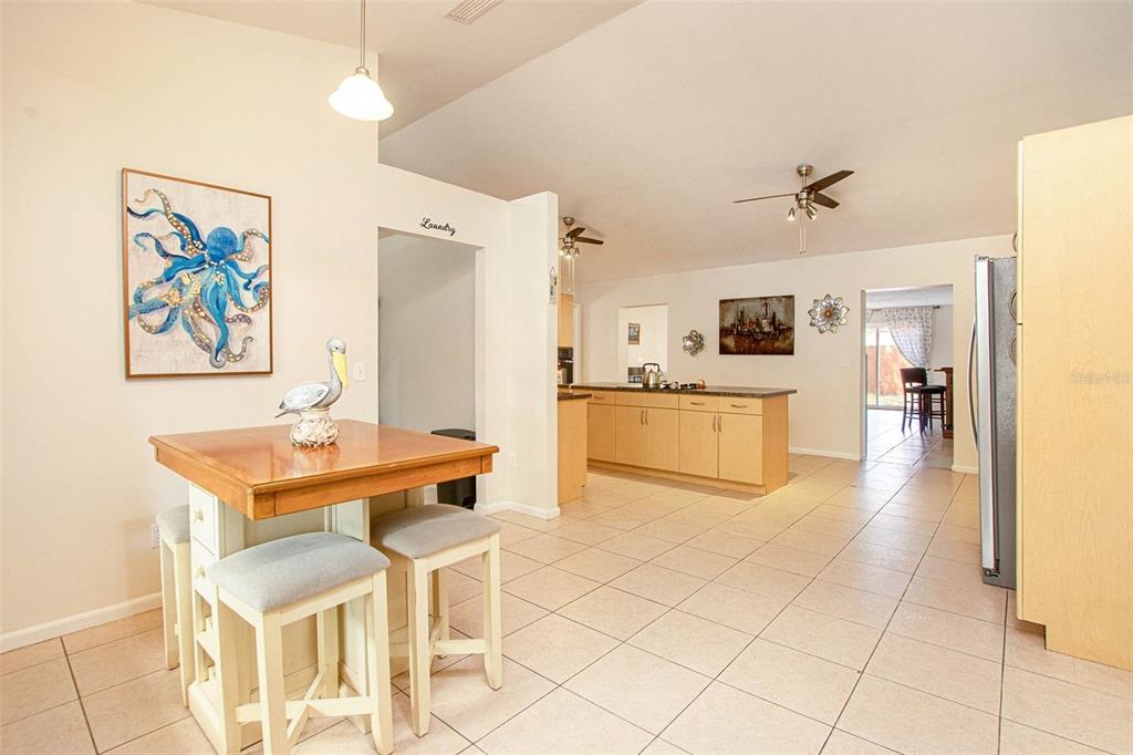 4105 Spring Way Circle Valrico, FL 33596 - Photo 8 of 34 a living room with stainless steel appliances kitchen island granite countertop furniture and a kitchen view