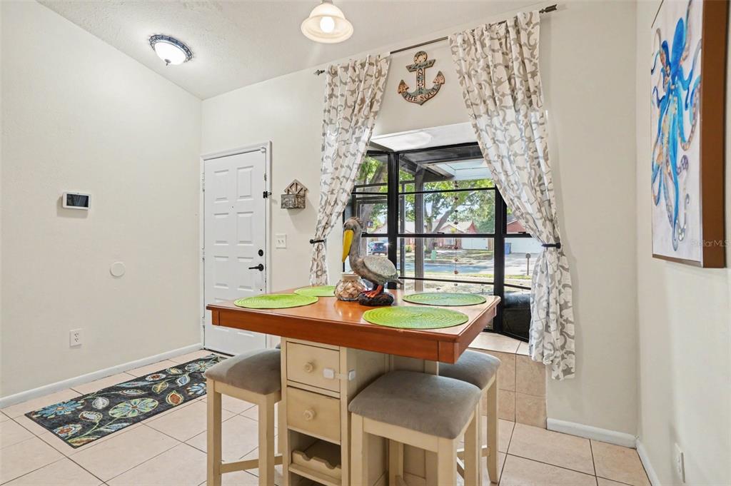 4105 Spring Way Circle Valrico, FL 33596 - Photo 9 of 34 a view of a dining room with furniture and window