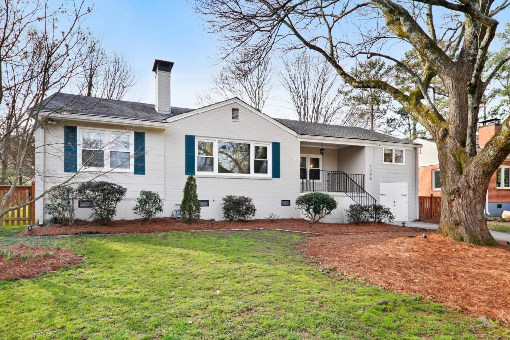 2295 Eastway Road Decatur, GA 30033 - Photo 1 of 1 a front view of a house with garden