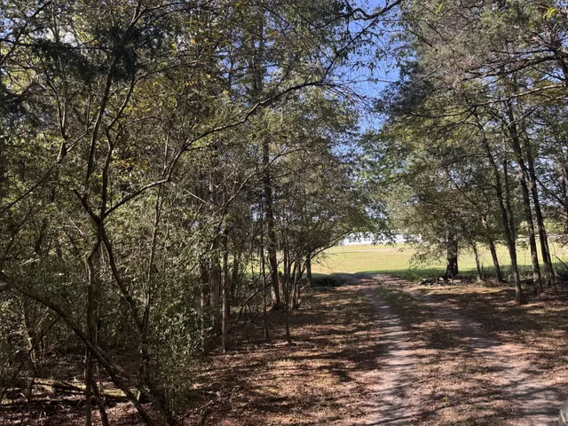 a swimming pool with an outdoor space and seating area